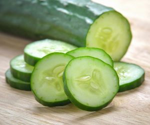 Fresh Cucumber  slices on wood background